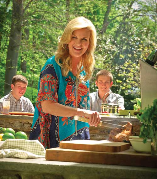 Trisha Yearwood cooking a steak.