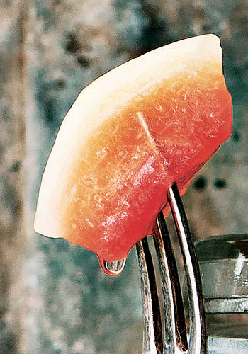 Pickled watermelon rind on a fork
