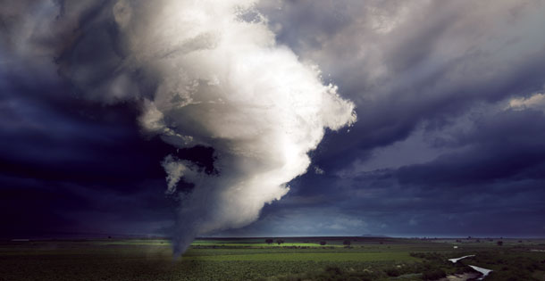 A tornado sweeps across an open field in the US. Source: Shutterstock.com