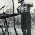 Charles Demport loads his long rifle