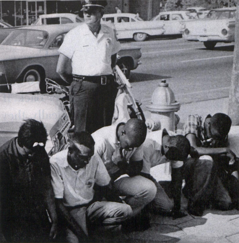 Black activists on knees