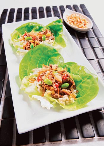 beef, carrots, and edamame set in Bibb lettuce leaf