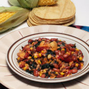 plate of chilaquiles with corn and tortillas