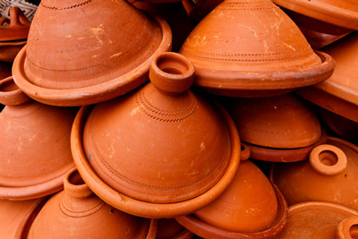 Pile of clay tangine cooking pots in Medina, marketplace, Meknes, Morocco.