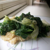 cooked greens over quinoa