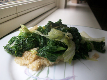 cooked greens over quinoa