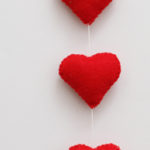 Felt Heart Mobile from Craft-a-Day by Sarah Goldschadt three hearts hanging on a string