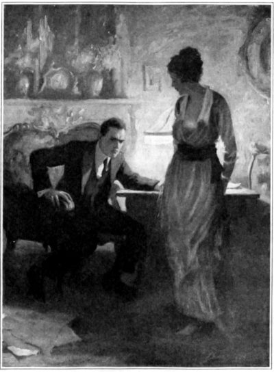 Woman talking to a man in his study.