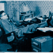 William Hazlett Upson resting at his desk
