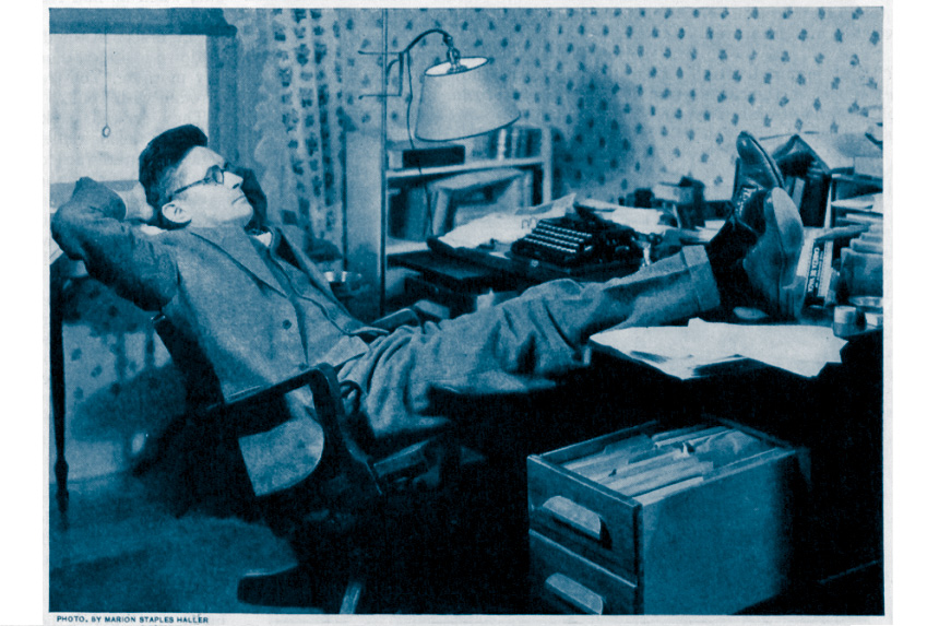 William Hazlett Upson resting at his desk