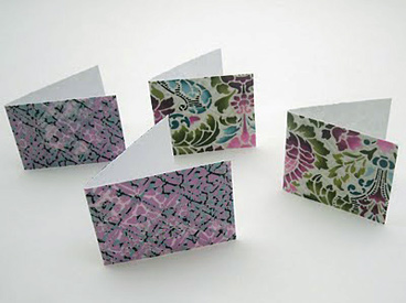 four fabric-covered cards