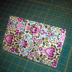 folded fabric-covered card stock