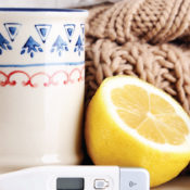 Ceramic mug, lemon, thermometer, tissue, sweater