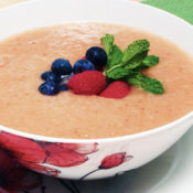 fruit soup topped with blueberries and strawberries