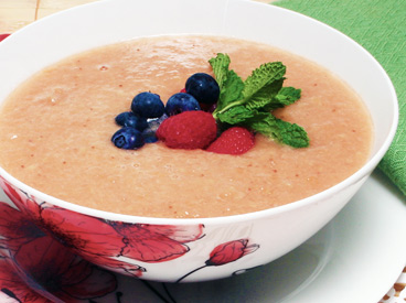 fruit soup topped with blueberries and strawberries