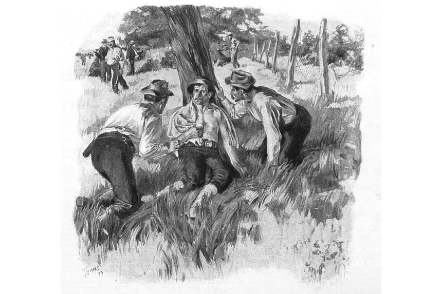 Man resting under a tree with his arm in a sling, while two other men tend to him