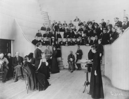 Alice Hamilton in a classroom full of young women