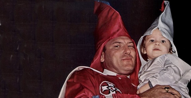 Klansman holding his kid