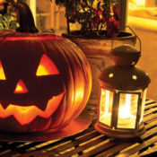 jack-o'-lantern on table with lantern