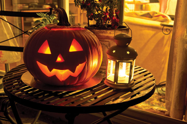 jack-o'-lantern on table with lantern