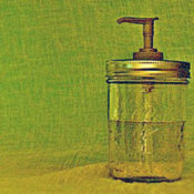 Glass jar soap dispenser.
