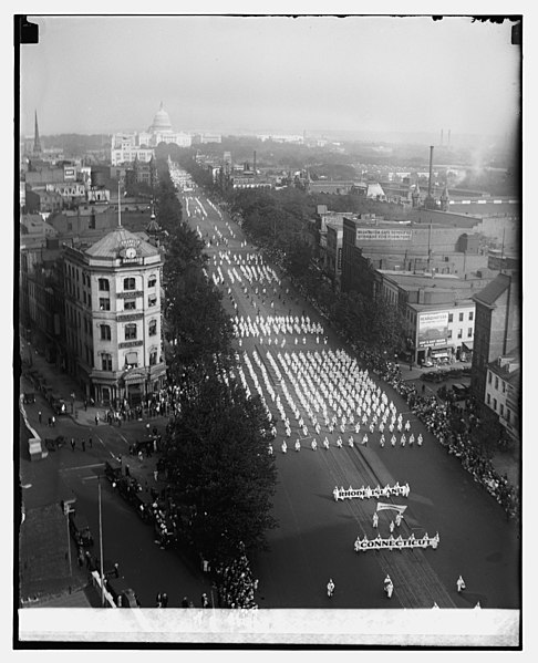 Photo of a large group of Ku Klux Klan members as they march through Washington D.C.