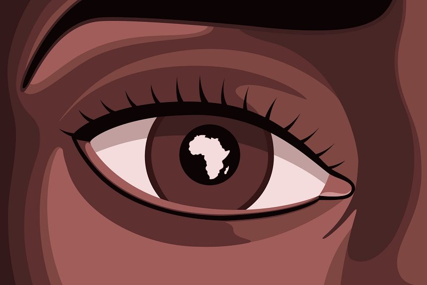 Close up of a Black woman's eye that has the continent of Africa reflected in her iris