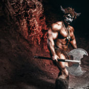 A buff minotaur in a cave wielding a double-bladed axe.