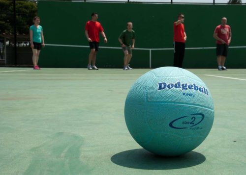 A dodgeball resting on the court