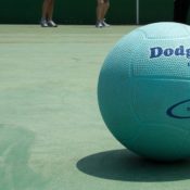 A dodgeball resting on a court