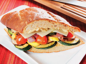 squash, tomato, mushroom, onion, and cheese sandwich