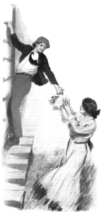 A man holds out his hand to a woman while hanging onto a train as it moves past her.