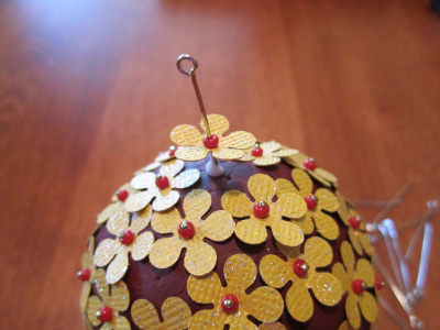 sticking eye pin in ball ornament