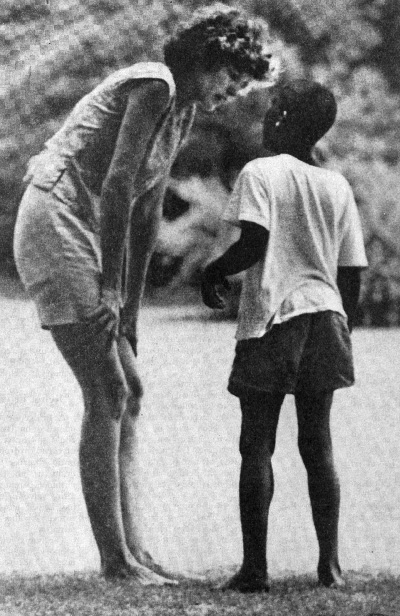 Eunice counsels Wendell, a nine-year-old with the mind of a child of four, during a lull at Shriver day camp.<br />Photo by Jacques Lowe