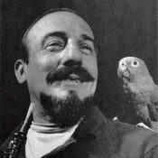 Mitch Miller with a parrot on his shoulder.