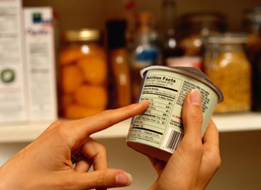 Woman reading nutrition label