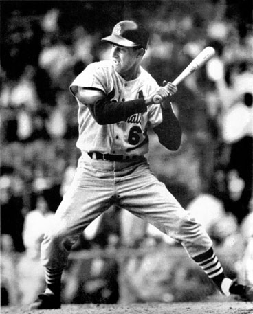All concentration, still sturdy on the aging legs, still sharp of eye, Musial takes one tight.