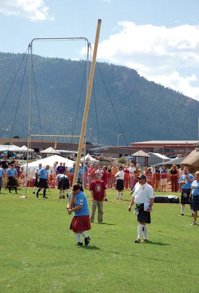 Athletes adorn their kilts for the annual caber toss competition