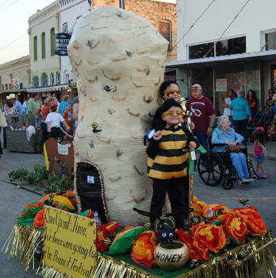 The Floresville, Texas Peanut Festival parade features floats and amusement for over 15,000 visitors.