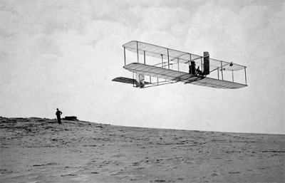 October 1911, Dare County, North Carolina, USA --- Orville Wright flies a glider over Kill Devil Hills. Image by © Bettmann/CORBIS.  All Rights Reserved