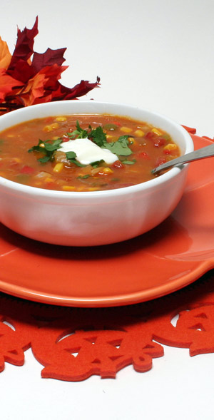 bowl of pumpkin stew with dollop of sour cream