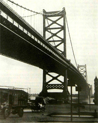 Delaware River Bridge (now called the Benjamin Franklin Bridge) between Philadelphia and Camden.