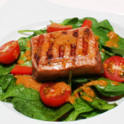 salmon, spinach, tomato salad with ginger and carrot dressing
