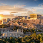 A bright sunset shining on the Parthenon.