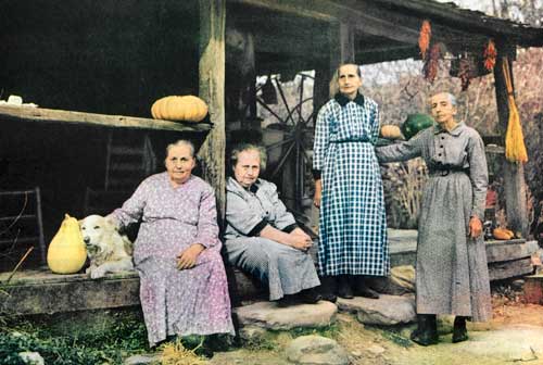 The remaining Walker sisters sit on the front porch.