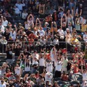 People Performing "the wave" at Baseball Game