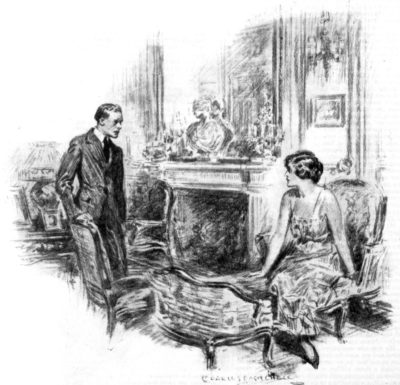 A man speaks to a woman