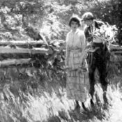 A young couple walking in a field