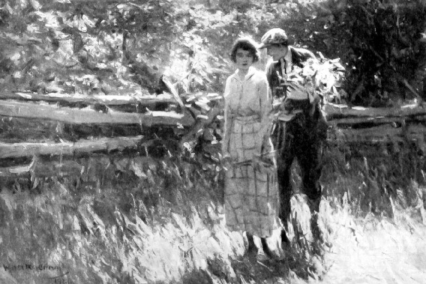 A young couple walking in a field