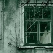 Spooky girl in window